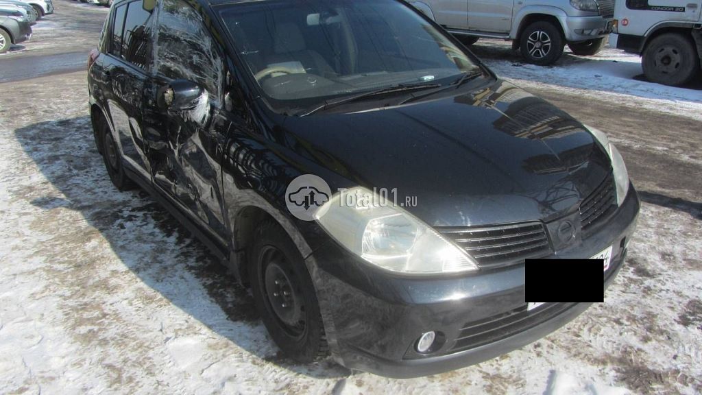 Фото Nissan Tiida 14
