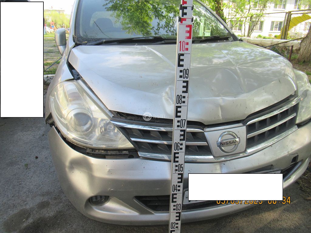 Фото Nissan Tiida 10