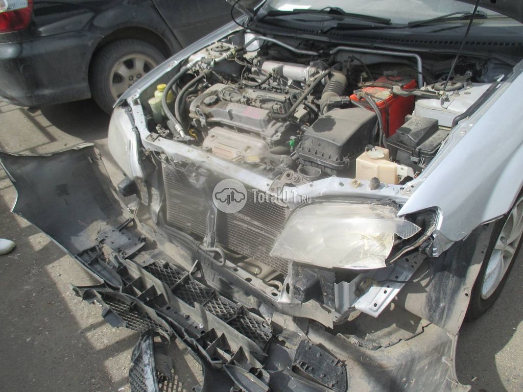 Фото Mazda Familia 4