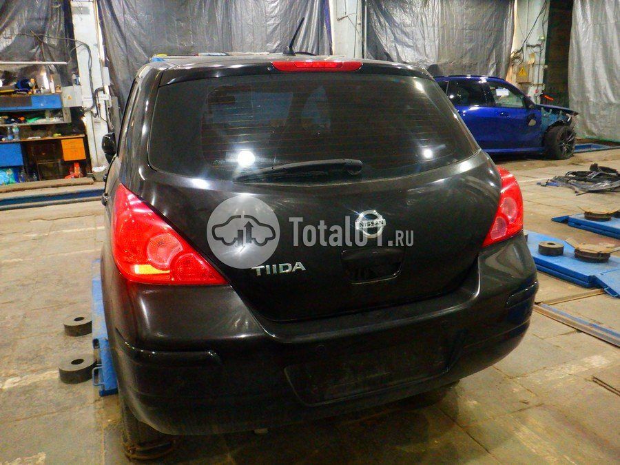 Фото Nissan Tiida 14