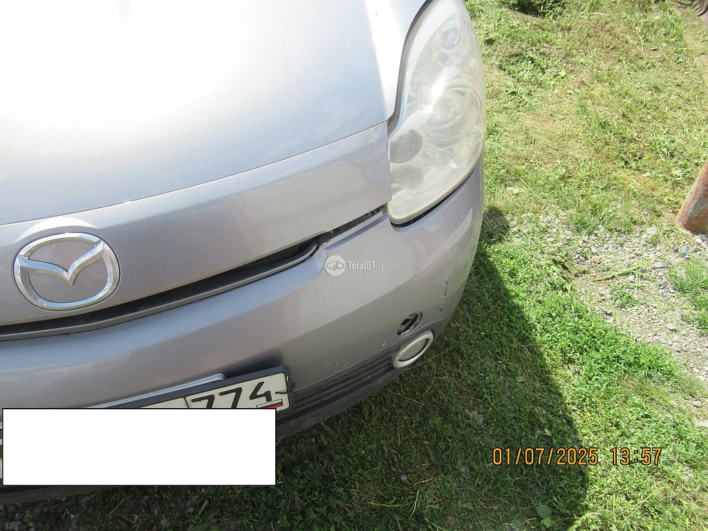 Фото Mazda Verisa 18