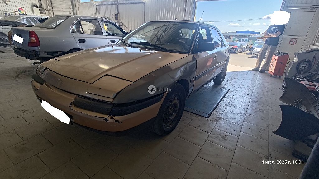 Фото Mazda 323 4