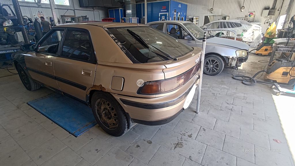 Фото Mazda 323 6