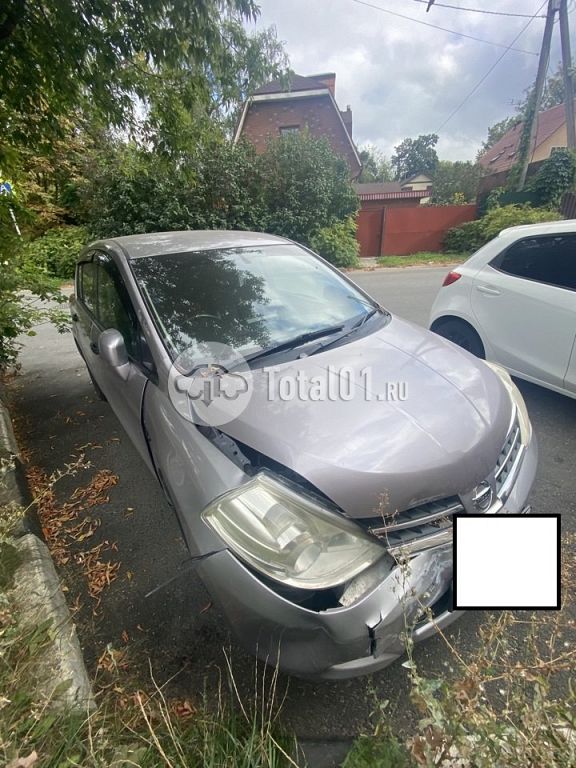 Фото Nissan Tiida 14