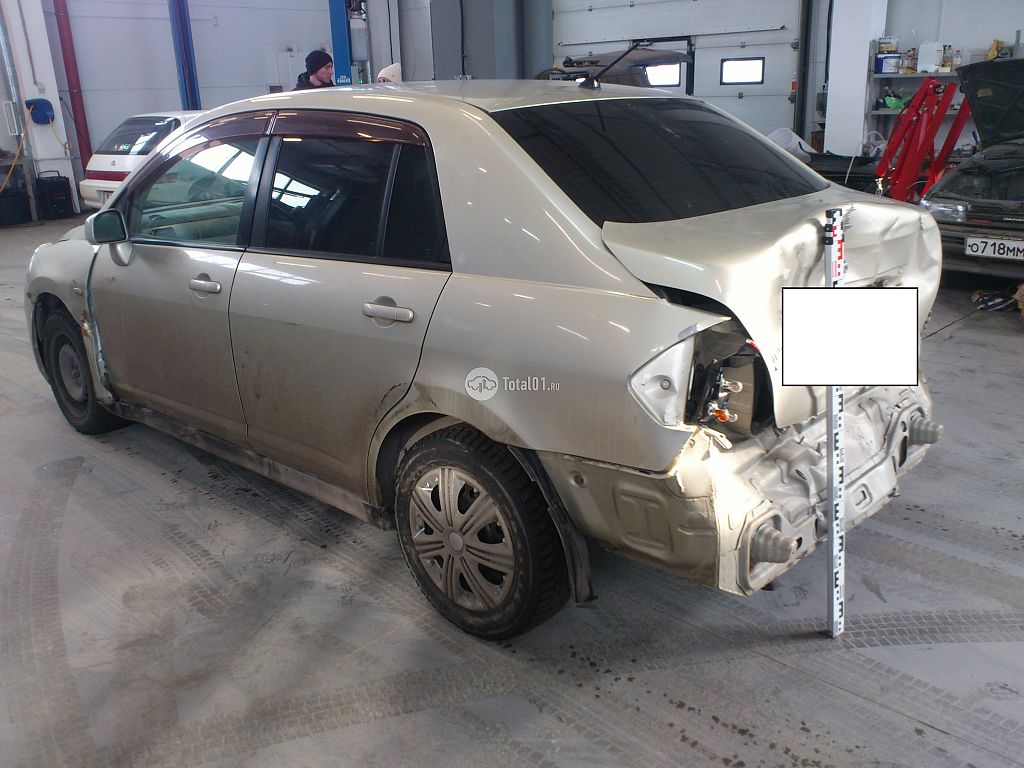 Фото Nissan Tiida 10