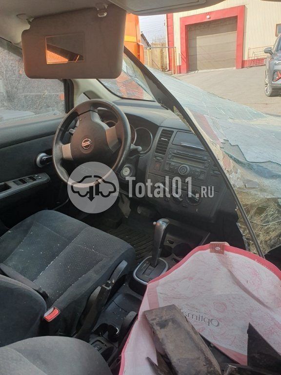 Фото Nissan Tiida 36