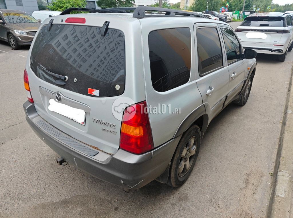 Фото Mazda Tribute 8
