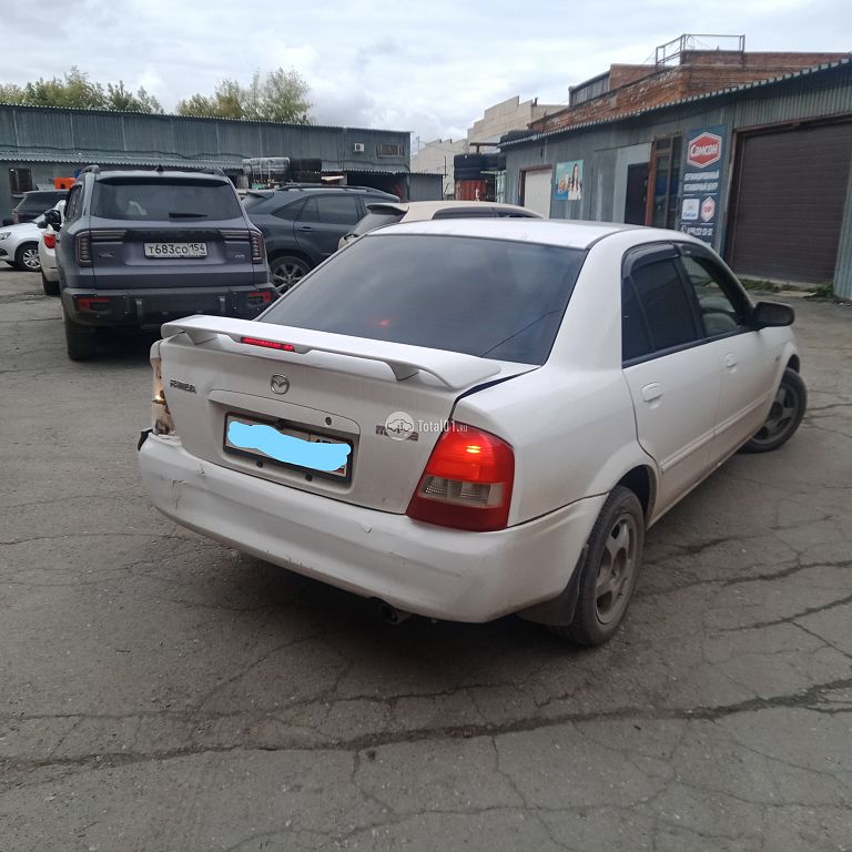 Фото Mazda Familia 64